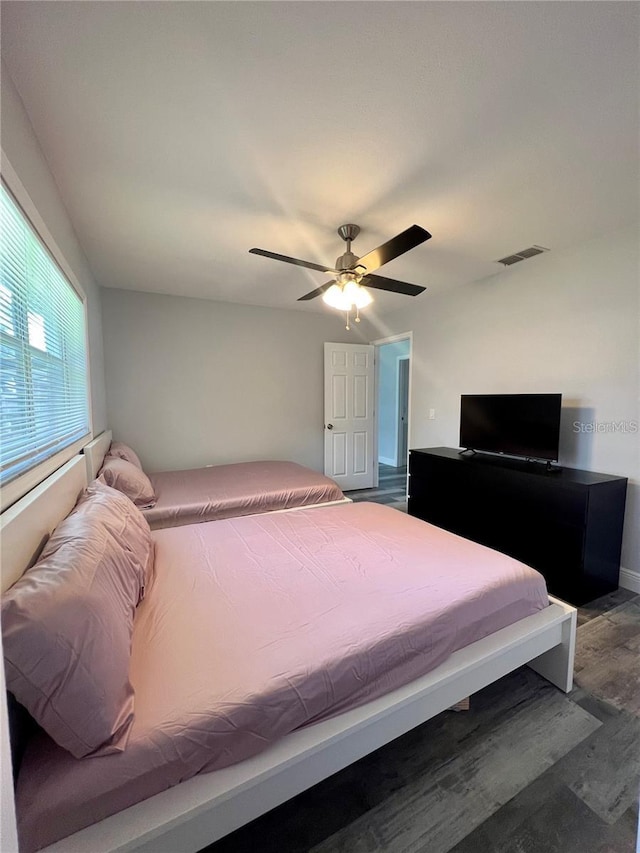 bedroom featuring hardwood / wood-style flooring and ceiling fan