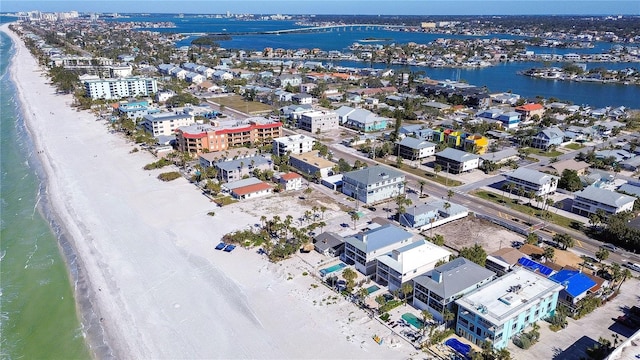 bird's eye view with a water view and a beach view