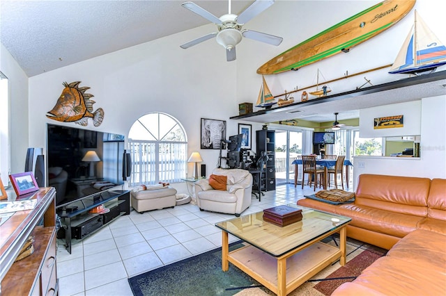 tiled living room featuring a textured ceiling, high vaulted ceiling, and ceiling fan