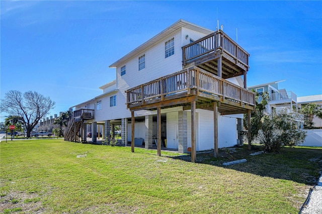 back of property with a wooden deck and a lawn