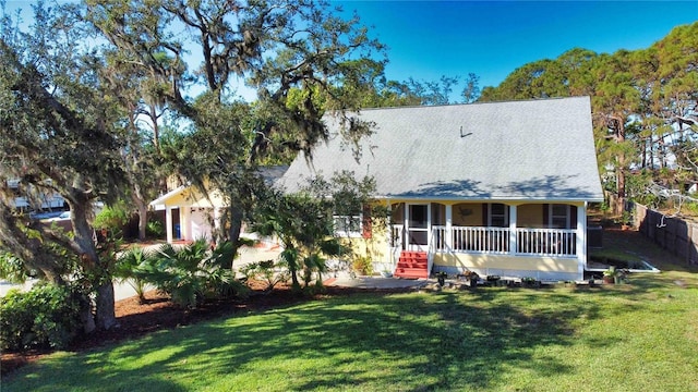 view of front of home featuring a front yard and covered porch