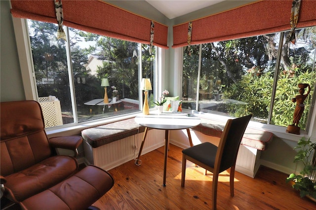 sunroom featuring lofted ceiling and a wealth of natural light