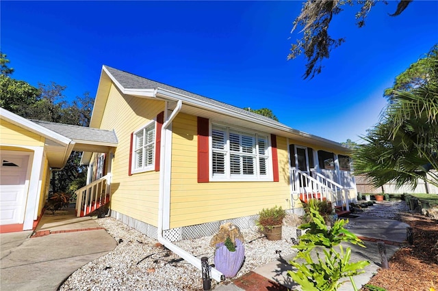 view of side of property with a garage