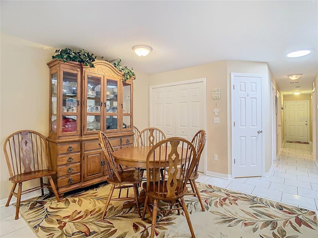 dining space with light tile patterned flooring