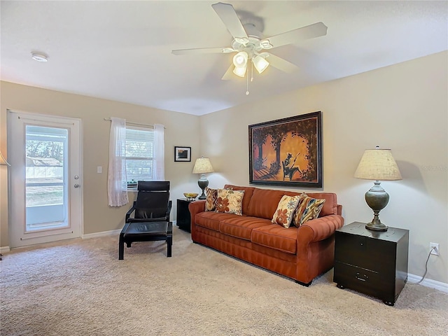 living room with light carpet and ceiling fan