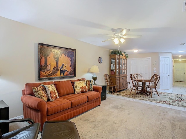 living room with ceiling fan and light carpet