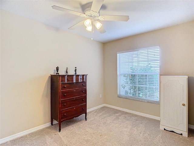 bedroom with light colored carpet and ceiling fan