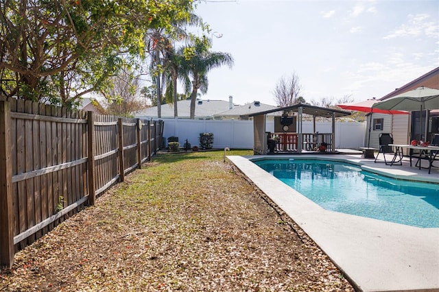 view of pool with a patio, a gazebo, a fenced backyard, and a fenced in pool