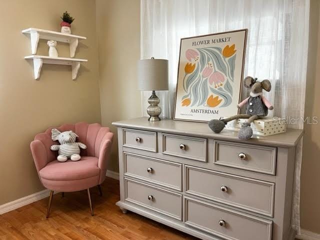 sitting room with light wood-style floors and baseboards