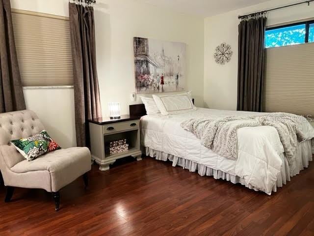 bedroom with wood finished floors