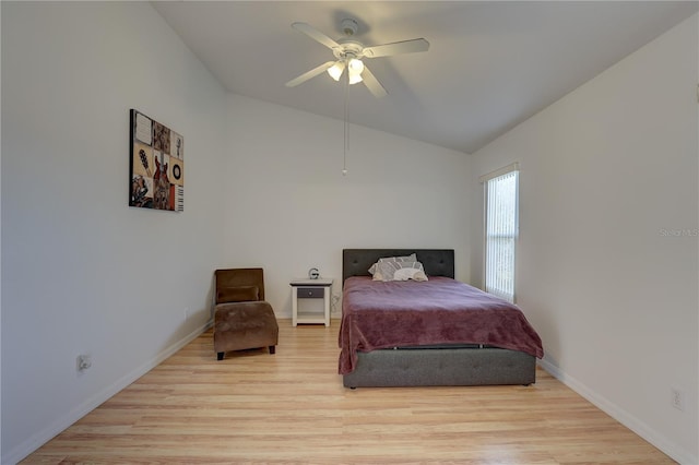 bedroom with lofted ceiling, light hardwood / wood-style floors, and ceiling fan