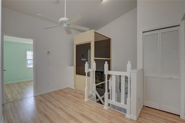 corridor with light hardwood / wood-style flooring