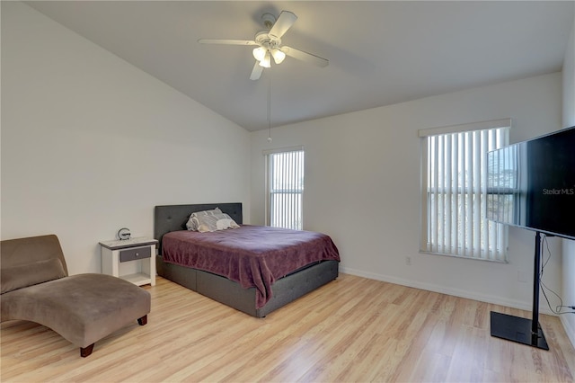 bedroom featuring vaulted ceiling, light hardwood / wood-style floors, and ceiling fan