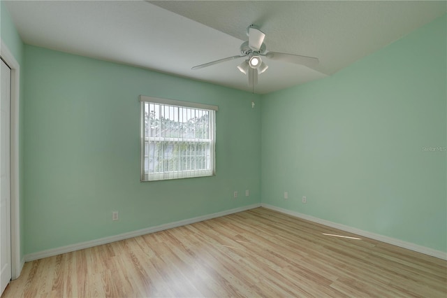 interior space with ceiling fan, light hardwood / wood-style floors, and a closet