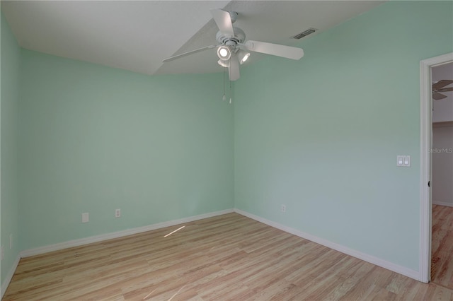 unfurnished room with ceiling fan and light wood-type flooring