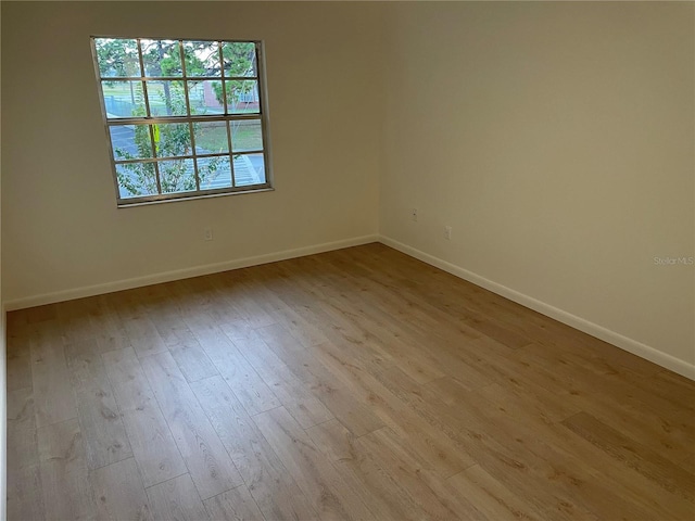 spare room featuring light hardwood / wood-style floors