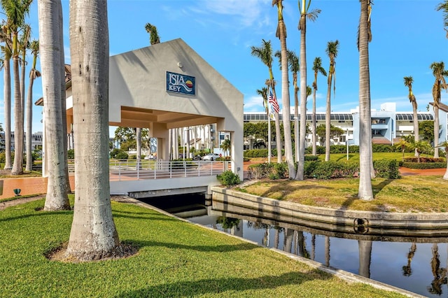 view of community with a yard, a gazebo, and a water view