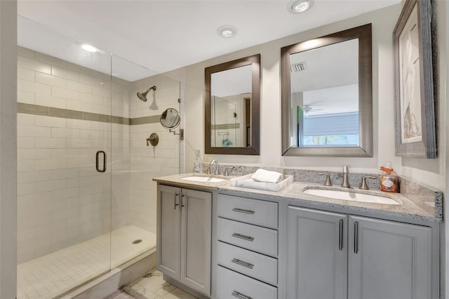bathroom with vanity and an enclosed shower