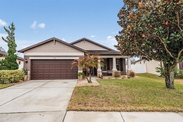 craftsman house featuring a garage, a front lawn, and a porch