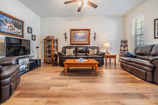 living room with ceiling fan and light hardwood / wood-style floors