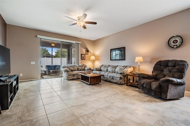 tiled living room featuring ceiling fan