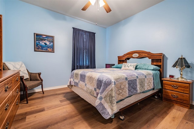 bedroom featuring ceiling fan and light hardwood / wood-style flooring