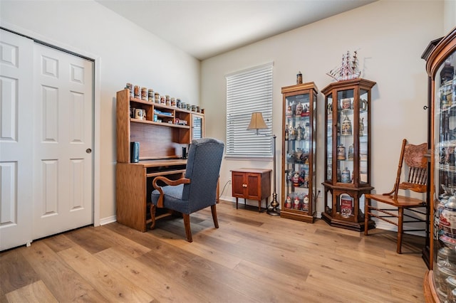 office featuring light wood-type flooring and baseboards