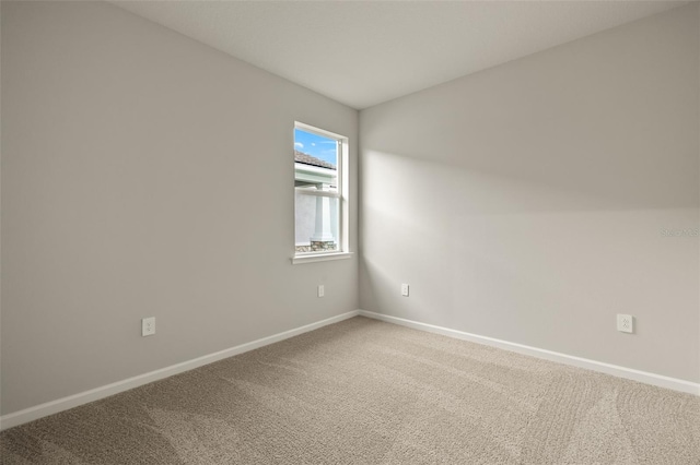 unfurnished room featuring carpet flooring