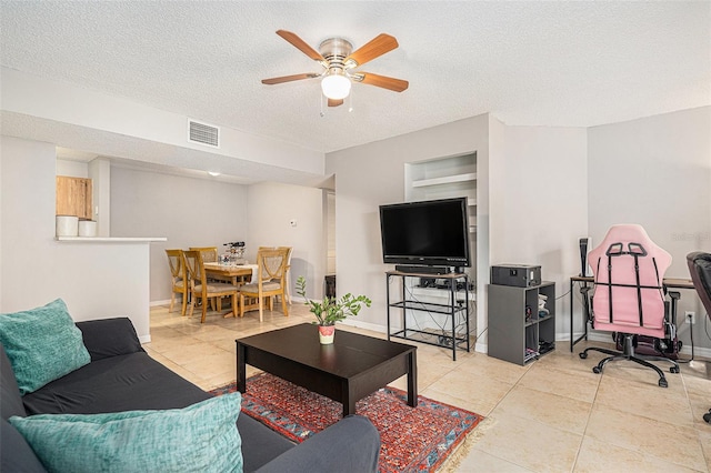 455 Alt 19 S Unit 268, Palm Harbor, FL 34683 - tiled living area featuring a ceiling fan and a textured ceiling