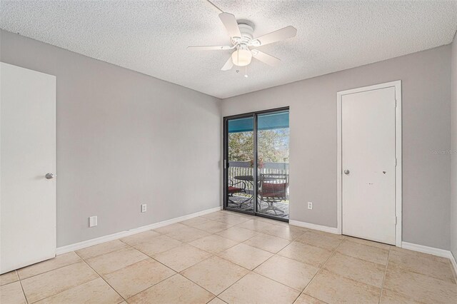 455 Alt 19 S Unit 268, Palm Harbor, FL 34683 - empty room featuring a textured ceiling, a ceiling fan, and light tile patterned floors