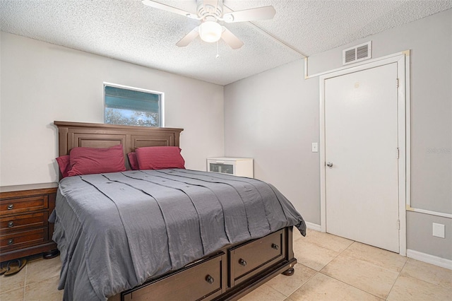 455 Alt 19 S Unit 268, Palm Harbor, FL 34683 - bedroom featuring a textured ceiling, light tile patterned flooring, and a ceiling fan