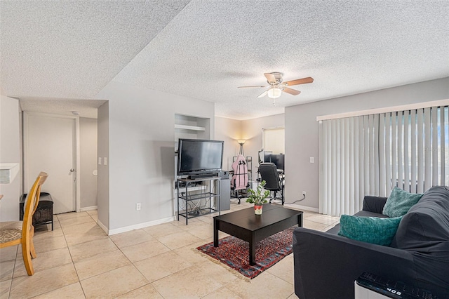 455 Alt 19 S Unit 268, Palm Harbor, FL 34683 - living room featuring a ceiling fan, light tile patterned flooring, and a textured ceiling