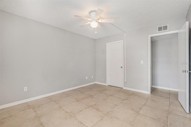 455 Alt 19 S Unit 268, Palm Harbor, FL 34683 - spare room featuring a textured ceiling, ceiling fan, and light tile patterned floors