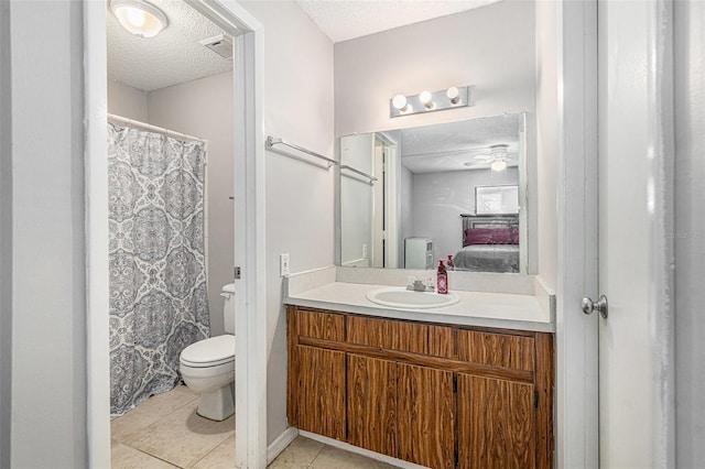 455 Alt 19 S Unit 268, Palm Harbor, FL 34683 - full bathroom featuring a textured ceiling, vanity, tile patterned flooring, and connected bathroom