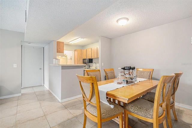 455 Alt 19 S Unit 268, Palm Harbor, FL 34683 - dining space with a textured ceiling and light tile patterned floors