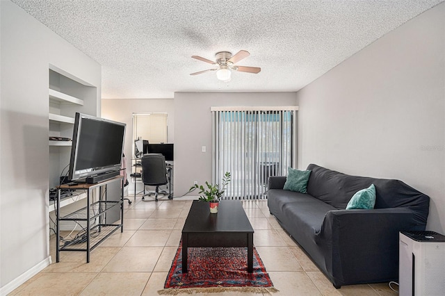 455 Alt 19 S Unit 268, Palm Harbor, FL 34683 - living room featuring an office area, ceiling fan, a textured ceiling, light tile patterned flooring, and built in shelves