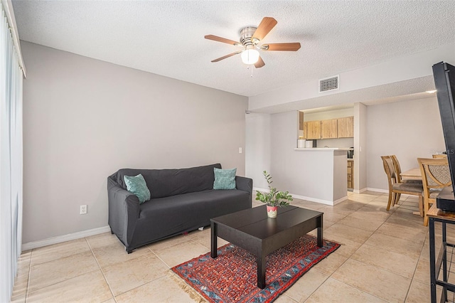 455 Alt 19 S Unit 268, Palm Harbor, FL 34683 - living area featuring a ceiling fan, a textured ceiling, and light tile patterned floors