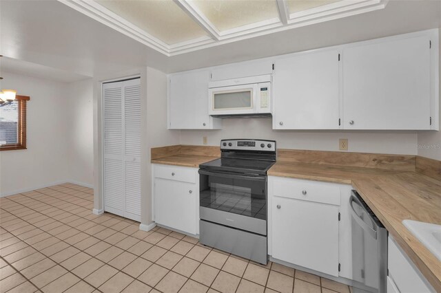 kitchen with white cabinetry, stainless steel appliances, and light countertops