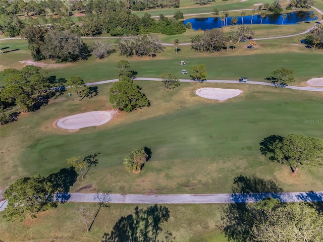 bird's eye view featuring a water view and golf course view