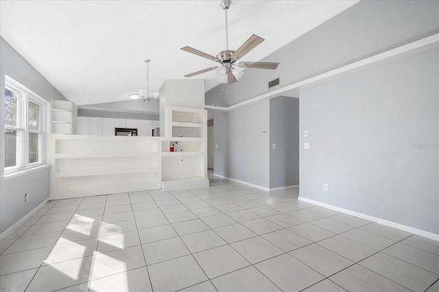 unfurnished living room featuring vaulted ceiling, ceiling fan with notable chandelier, and light tile patterned floors