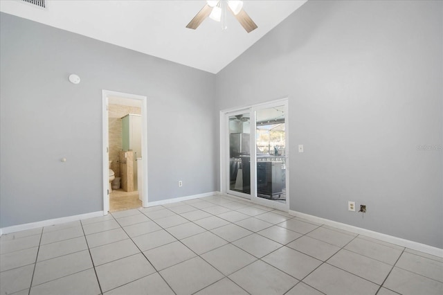 tiled spare room featuring high vaulted ceiling and ceiling fan