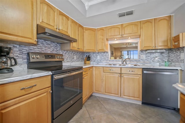 kitchen with stainless steel appliances, light tile patterned flooring, sink, and backsplash