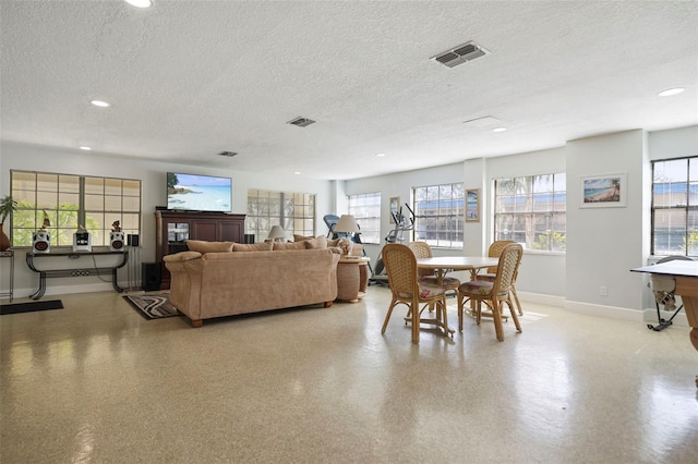 living room with a textured ceiling