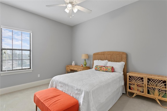 bedroom featuring ceiling fan and carpet