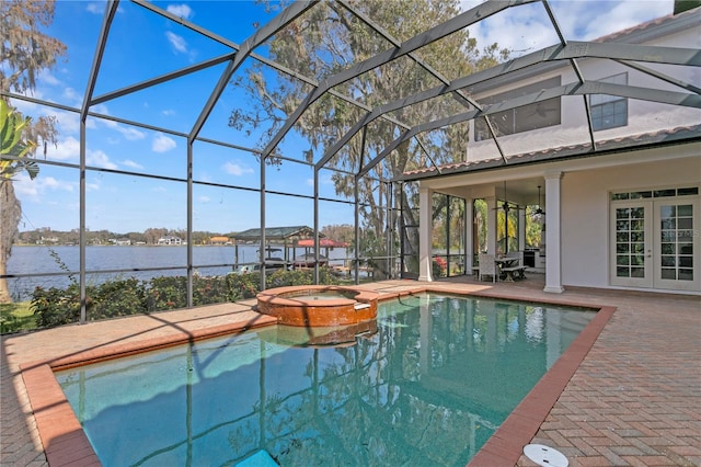 view of pool featuring french doors, a water view, glass enclosure, an in ground hot tub, and a patio