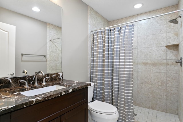 bathroom with vanity, a shower with shower curtain, and toilet