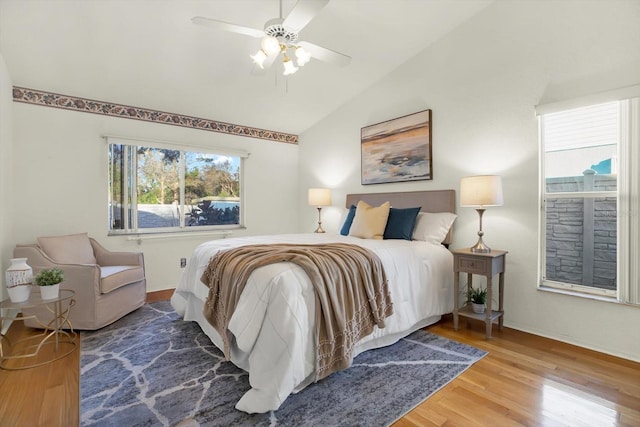 bedroom featuring hardwood / wood-style flooring, ceiling fan, and vaulted ceiling