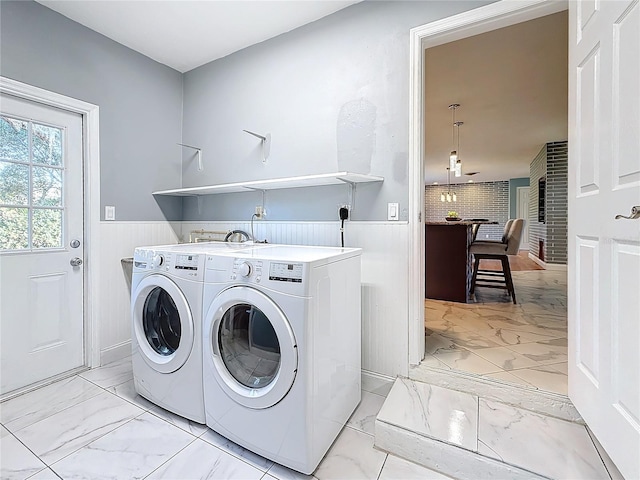 laundry room featuring washing machine and clothes dryer