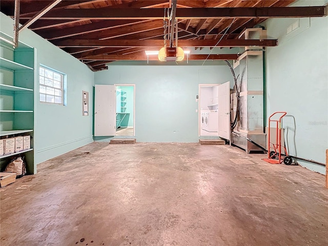 garage featuring a garage door opener and washing machine and dryer