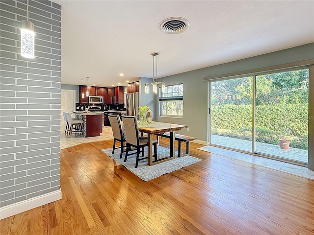 dining room featuring light hardwood / wood-style floors